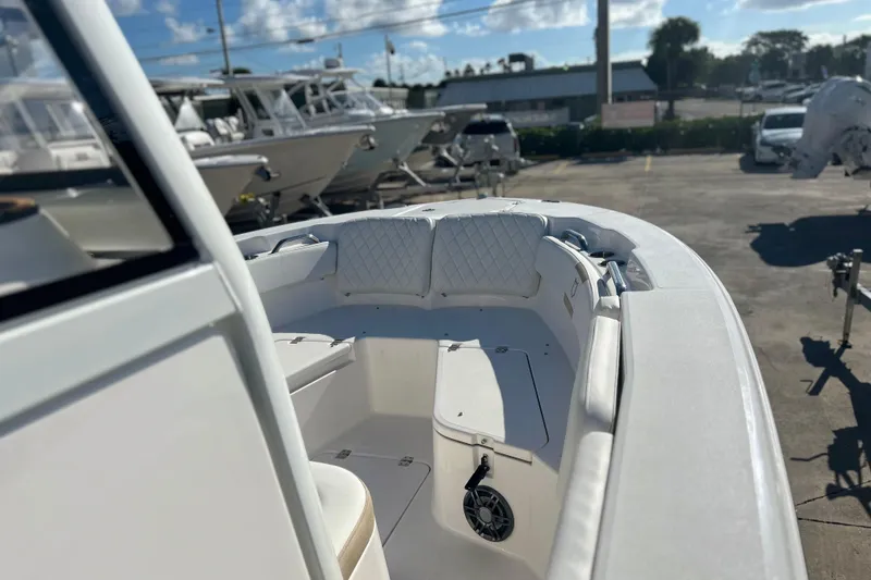 Slide: The Image of 2026 Sea Fox 228 Commander boat interior with cushioned seating and storage compartments. - 34