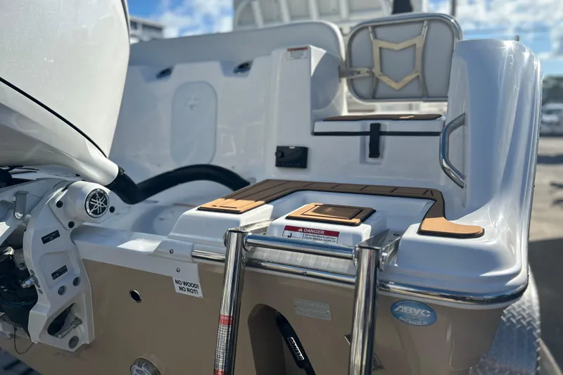 Slide: The Image of 2026 Sea Fox 228 Commander boat stern with motor and seating details. - 35