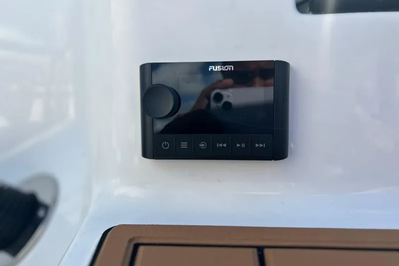 Slide: The Image of Fusion audio control panel on 2026 Sea Fox 228 Commander boat dashboard. - 36