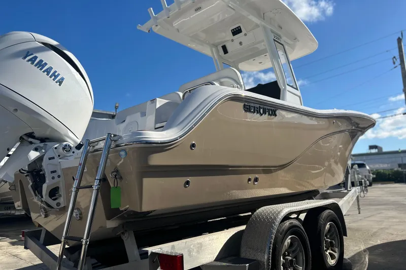 Slide: The Image of 2026 Sea Fox 228 Commander boat on trailer with Yamaha engine under clear sky. - 37