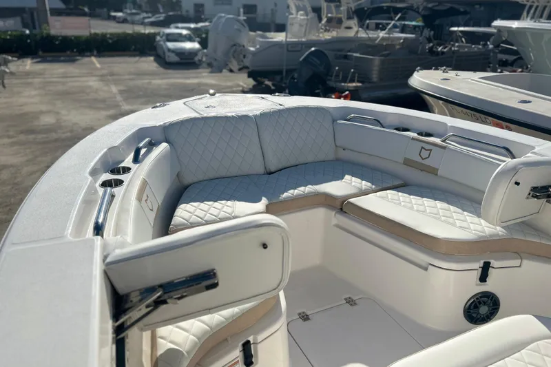 Slide: The Image of 2026 Sea Fox 228 Commander boat with luxurious white seating and cup holders. - 6