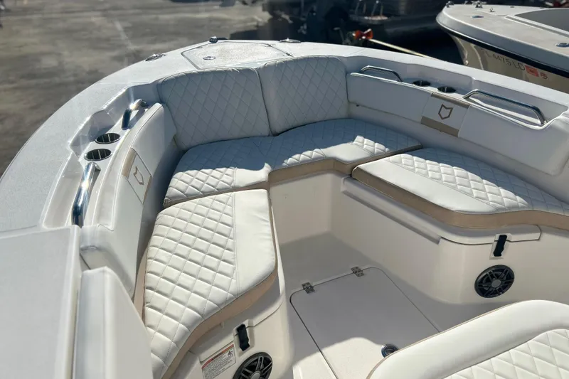 Slide: The Image of Luxurious seating on 2026 Sea Fox 228 Commander boat, featuring quilted upholstery and cup holders. - 7