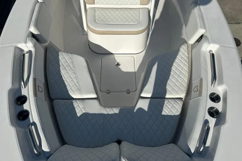 Slide: The Image of 2026 Sea Fox 228 Commander boat interior with diamond-stitched seating and cup holders. - 8
