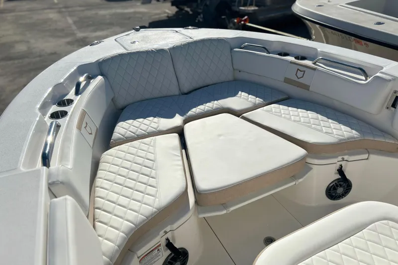 Slide: The Image of 2026 Sea Fox 228 Commander boat with luxurious white seating and cup holders. - 9