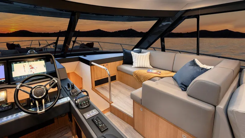 Slide: The Image of Luxurious interior of 2024 Riviera 585 SUV yacht at sunset. - 16