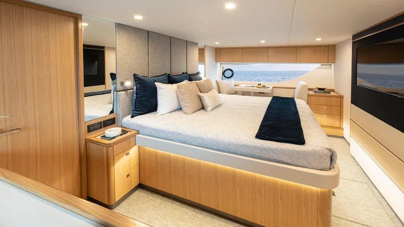 Slide: The Image of Luxurious bedroom interior of 2024 Riviera 585 SUV yacht with ocean view. - 21