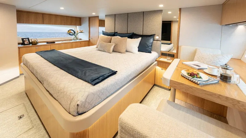 Slide: The Image of Luxurious bedroom interior of 2024 Riviera 585 SUV yacht with modern decor and ocean view. - 22