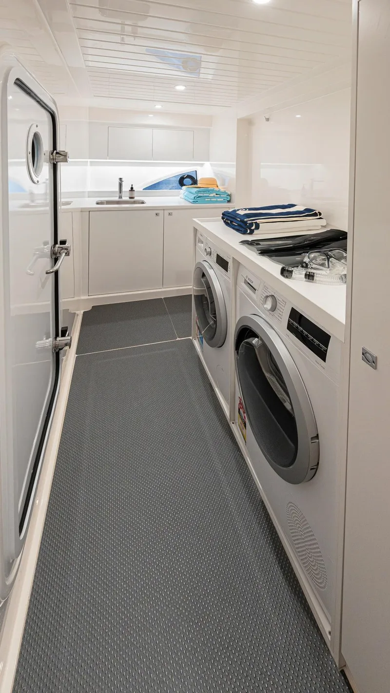 Slide: The Image of 2024 Riviera 585 SUV laundry room with washer and dryer. - 29