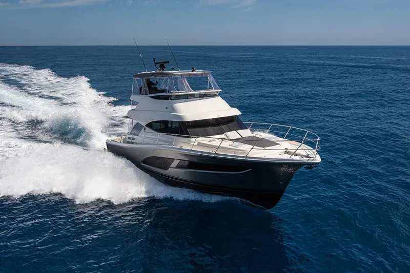 The Image of 2026 Riviera 46 Sports Motor Yacht cruising on open sea. - 0