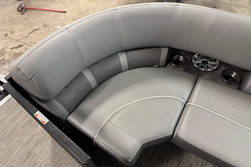 Slide: The Image of 2020 Bennington SXP 25 SSBXP boat interior with gray seating and cup holders. - 11