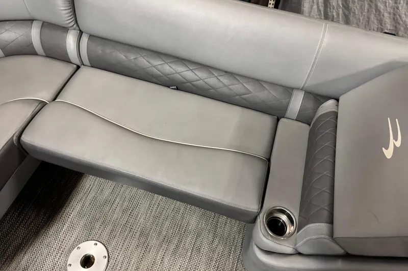 Slide: The Image of 2020 Bennington SXP 25 SSBXP boat interior with gray cushioned seating and cup holder. - 15