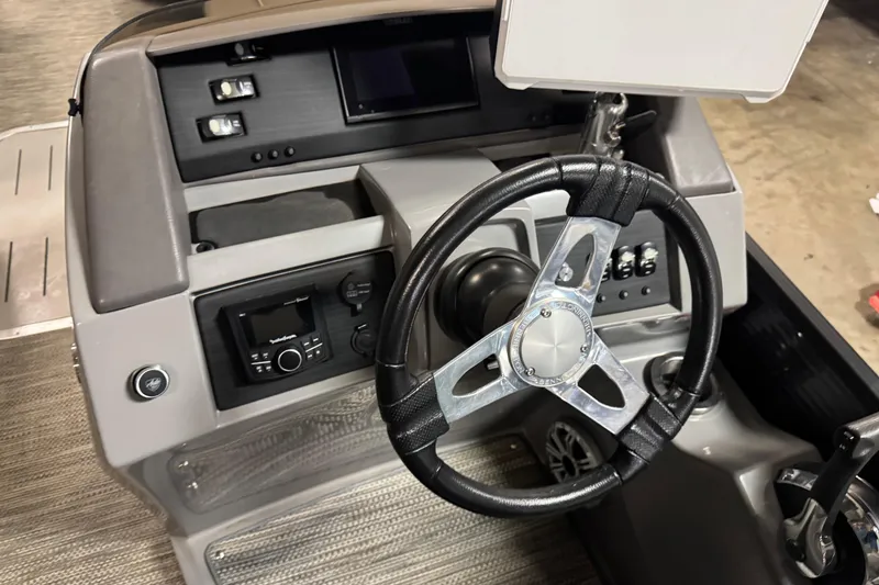 Slide: The Image of 2020 Bennington SXP 25 SSBXP boat dashboard with steering wheel and controls. - 19