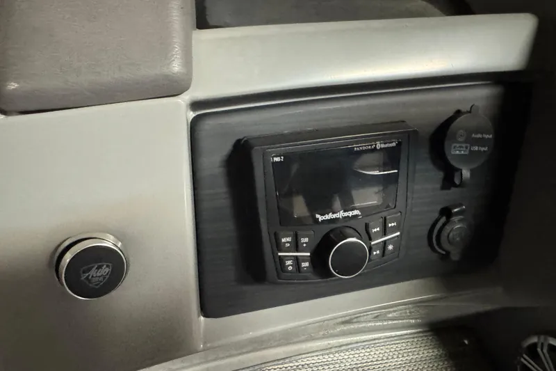 Slide: The Image of 2020 Bennington SXP 25 SSBXP dashboard with Rockford Fosgate audio system and USB input. - 21