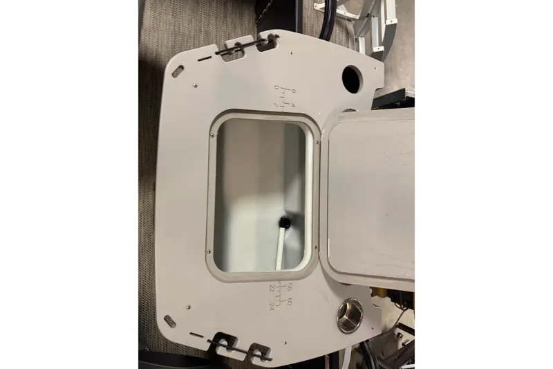 Slide: The Image of 2020 Bennington SXP 25 SSBXP boat compartment with open hatch and visible interior. - 25