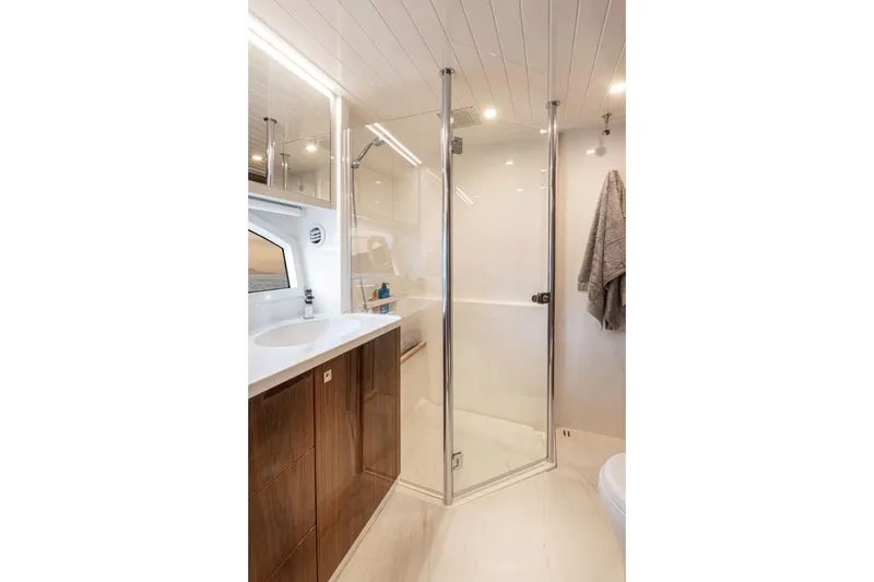 Slide: The Image of Luxurious bathroom in 2026 Riviera 64 Sports Motor Yacht Series II with modern fixtures. - 15