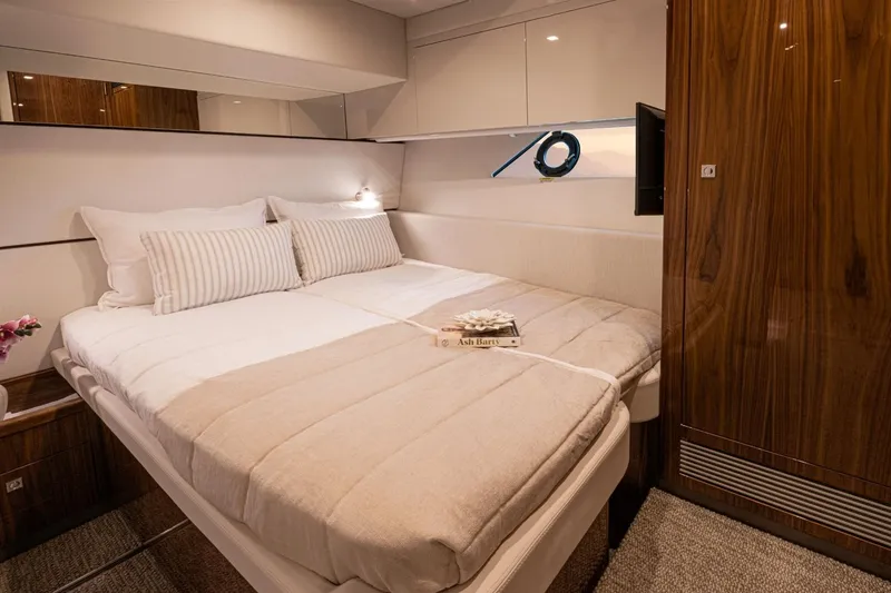 Slide: The Image of Luxurious bedroom interior of 2026 Riviera 64 Sports Motor Yacht Series II. - 18