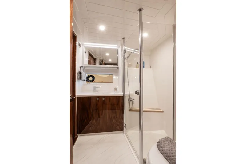 Slide: The Image of Luxurious bathroom in 2026 Riviera 64 Sports Motor Yacht Series II, featuring sleek design and modern fixtures. - 19