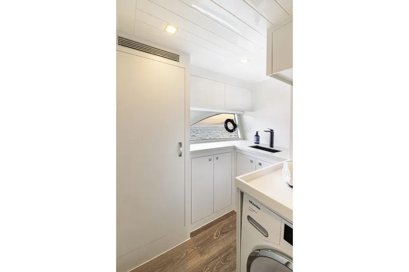 Slide: The Image of Modern laundry area in 2026 Riviera 64 Sports Motor Yacht Series II. - 26