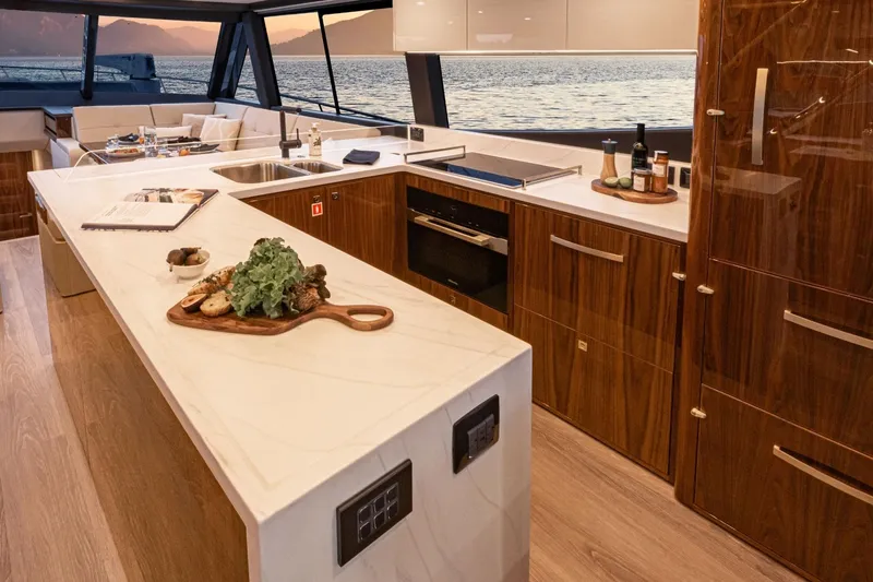 Slide: The Image of Luxurious kitchen interior of 2026 Riviera 64 Sports Motor Yacht Series II with ocean view. - 8