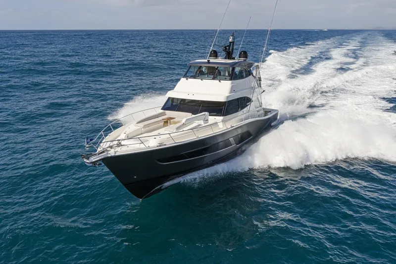 The Image of 2026 Riviera 68 Sports Motor Yacht Series II cruising on open sea. - 0