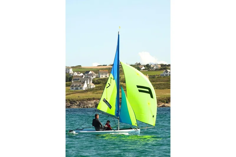Slide: The Image of Sailing boat with vibrant sails, SERO Innovation Fusion II, 2025 model, on open water. - 2