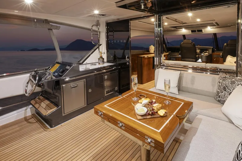 Slide: The Image of Luxurious interior of 2026 Riviera 72 Sports Motor Yacht with elegant seating and dining area. - 16