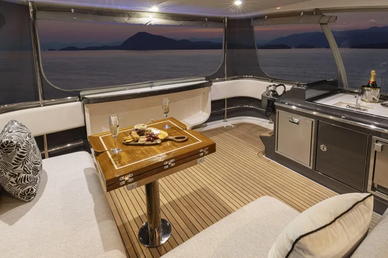 Slide: The Image of Luxurious interior of 2026 Riviera 72 Sports Motor Yacht with elegant dining setup. - 17