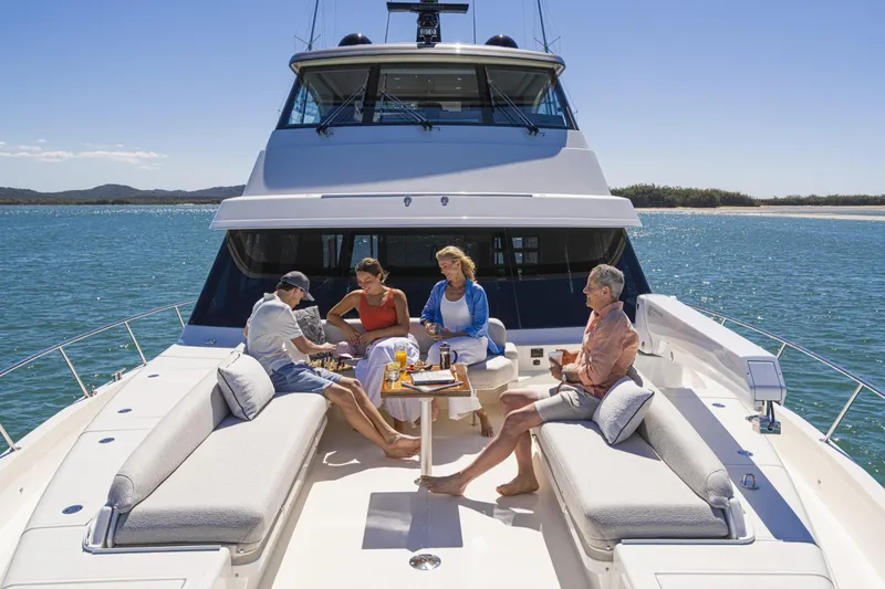 Slide: The Image of Group relaxing on 2026 Riviera 72 Sports Motor Yacht, enjoying sunny day on the water. - 18