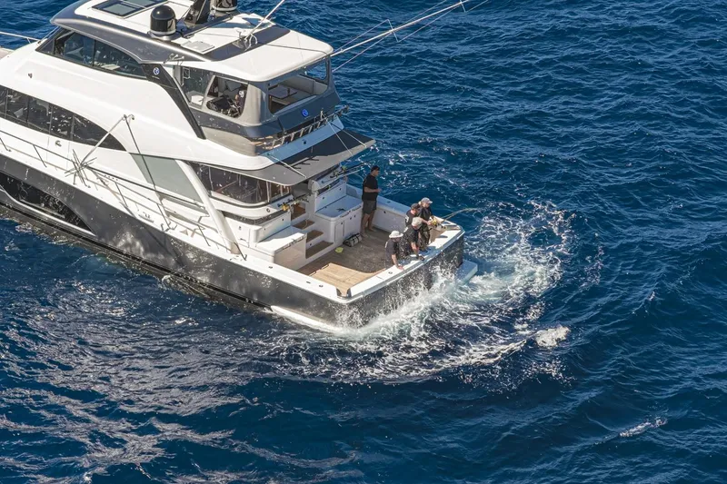 Slide: The Image of 2026 Riviera 72 Sports Motor Yacht Series II cruising on open sea. - 3