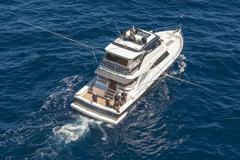 Slide: The Image of 2026 Riviera 72 Sports Motor Yacht Series II cruising on open blue sea. - 4