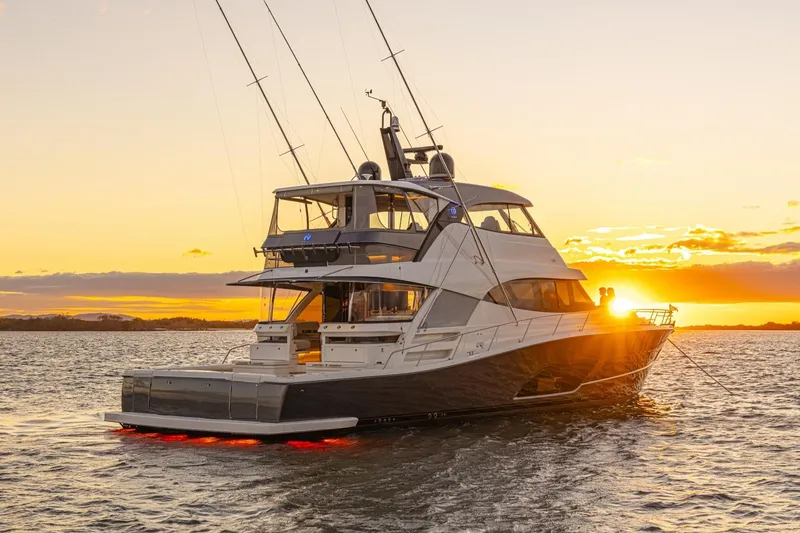 Slide: The Image of 2026 Riviera 72 Sports Motor Yacht at sunset on the water. - 5