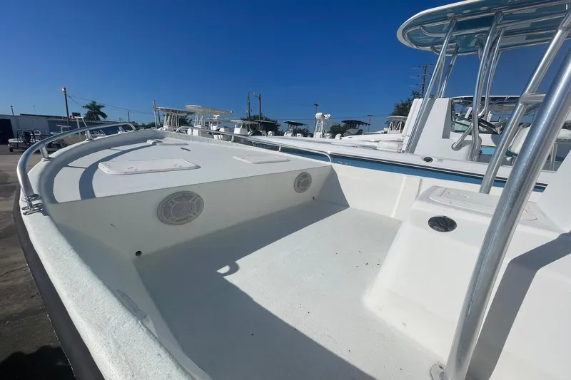 Slide: The Image of 2012 Slayer VS 19 boat deck with railings and storage compartments. - 5