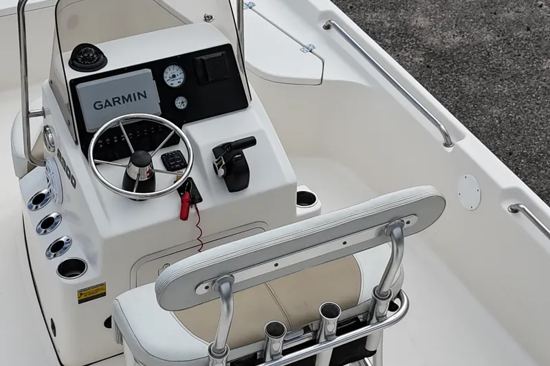 Slide: The Image of 2023 Bulls Bay 2200 boat console with Garmin navigation system and steering wheel. - 14