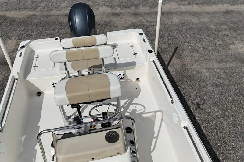 Slide: The Image of 2023 Bulls Bay 2200 boat interior with dual seats and steering console. - 15