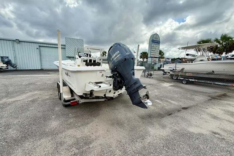 Slide: The Image of 2023 Bulls Bay 2200 boat with Yamaha engine on trailer, parked outdoors. - 4