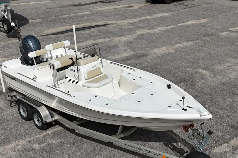 Slide: The Image of 2023 Bulls Bay 2200 boat on trailer, featuring sleek design and modern outboard motor. - 7