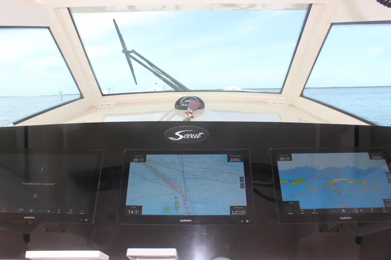 Slide: The Image of 2018 Scout 380 LXF boat dashboard with Garmin navigation screens. - 16