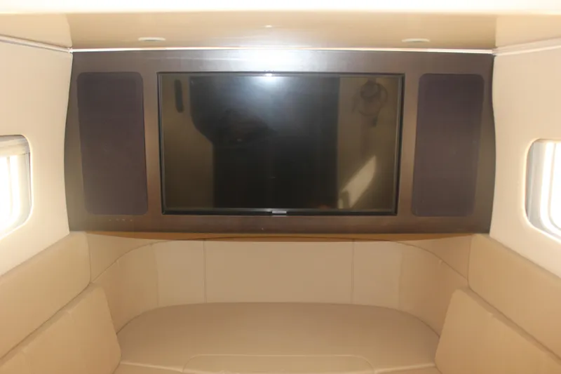 Slide: The Image of Interior of 2018 Scout 380 LXF with TV and beige seating. - 32