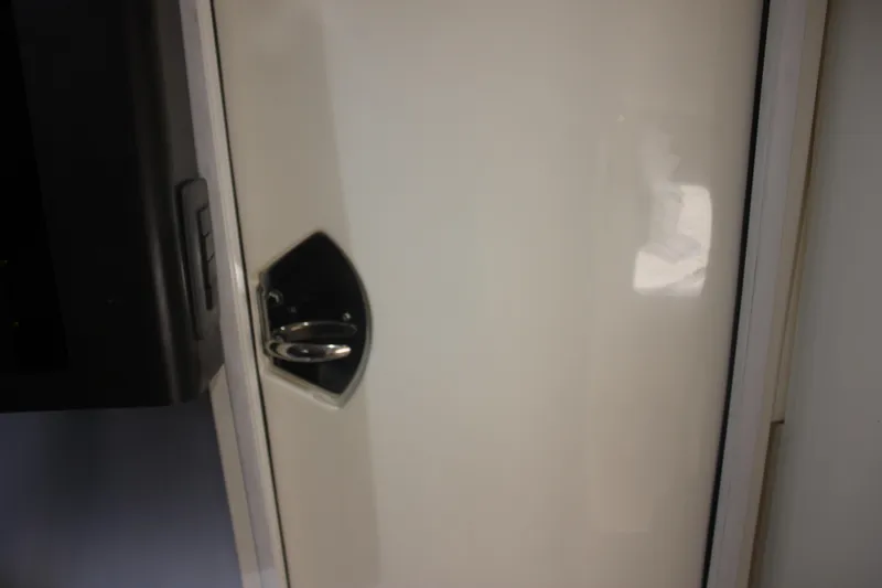 Slide: The Image of 2018 Scout 380 LXF cabin door with sleek handle design. - 33