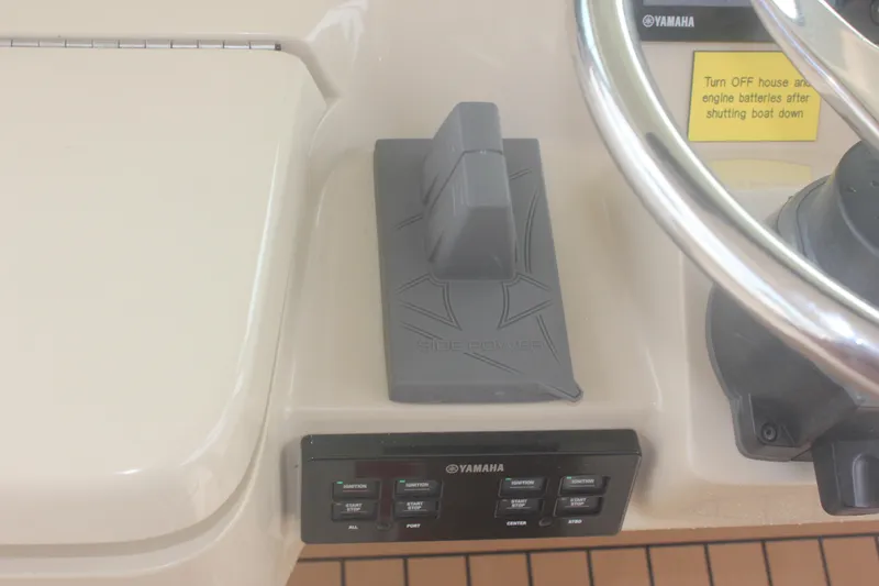 Slide: The Image of Control panel of 2018 Scout 380 LXF boat with Yamaha controls and steering wheel. - 35