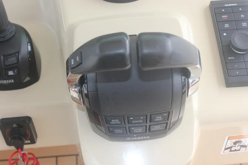 Slide: The Image of Control panel of a 2018 Scout 380 LXF boat with Yamaha throttle. - 37