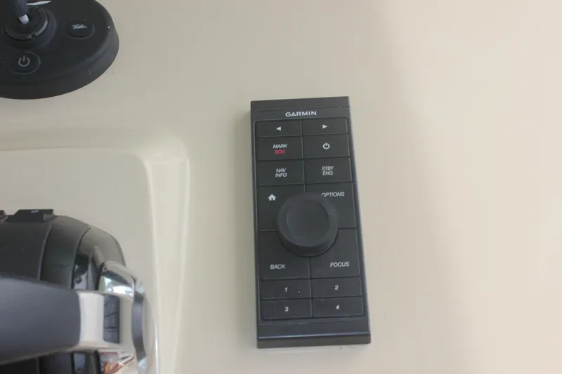 Slide: The Image of Garmin control panel on 2018 Scout 380 LXF boat dashboard. - 38