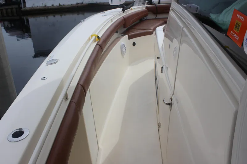 Slide: The Image of 2018 Scout 380 LXF boat interior with brown leather trim and sleek design. - 41