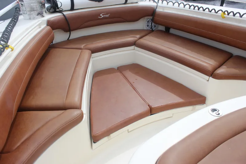 Slide: The Image of 2018 Scout 380 LXF boat interior with brown leather seating and white accents. - 42