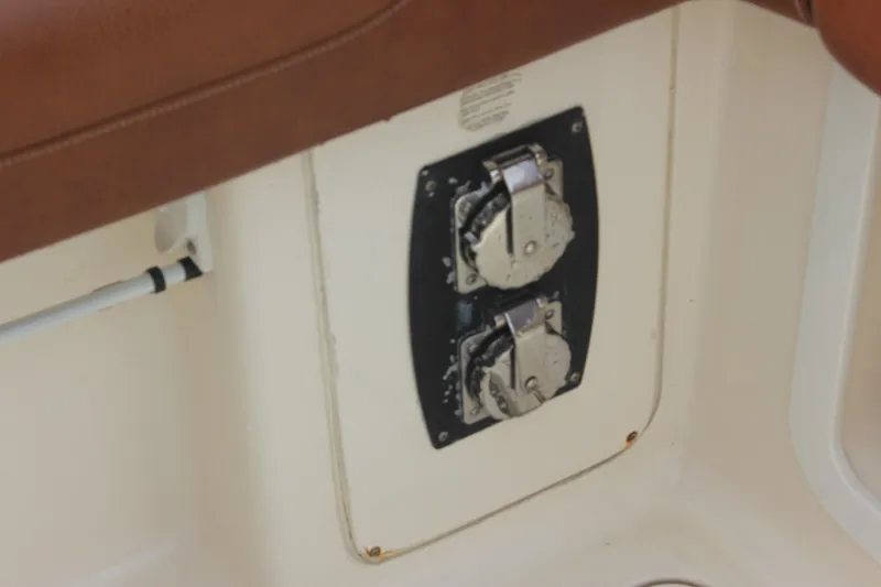 Slide: The Image of Close-up of control panel on 2018 Scout 380 LXF boat interior. - 62