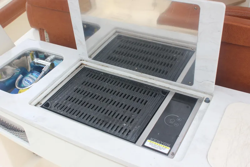 Slide: The Image of Built-in grill and sink on 2018 Scout 380 LXF boat. - 68