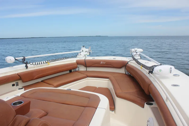 Slide: The Image of 2018 Scout 380 LXF boat with brown seating on open water. - 9