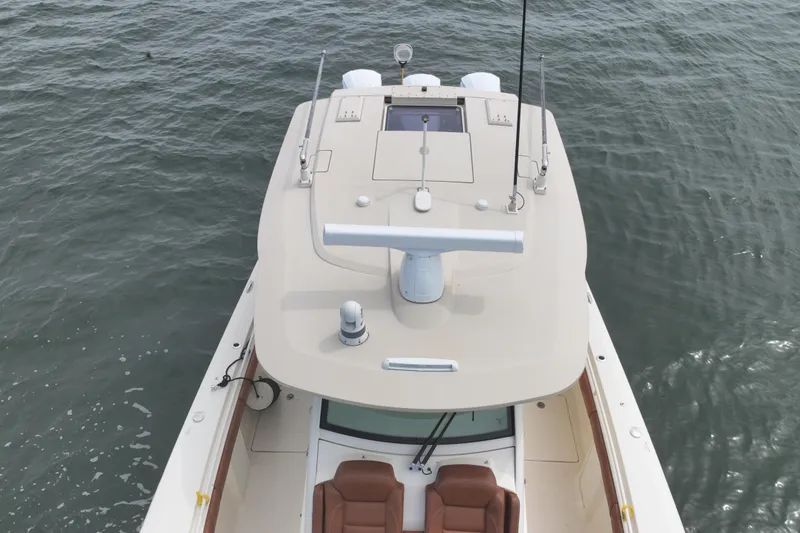 Slide: The Image of 2018 Scout 380 LXF boat, aerial view, on calm water. - 94