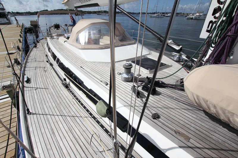 Slide: The Image of Deck view of 2004 Nautor Swan 62 yacht docked at marina. - 10