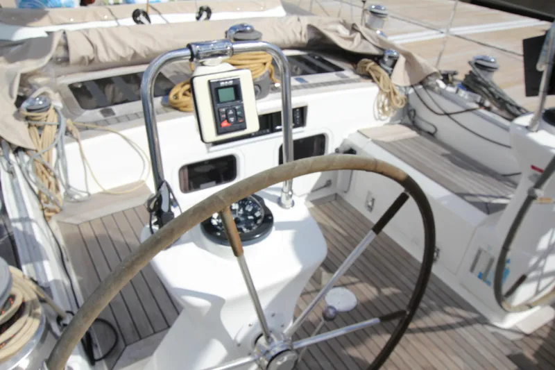 Slide: The Image of Cockpit of 2004 Nautor Swan 62 yacht with steering wheel and navigation equipment. - 21